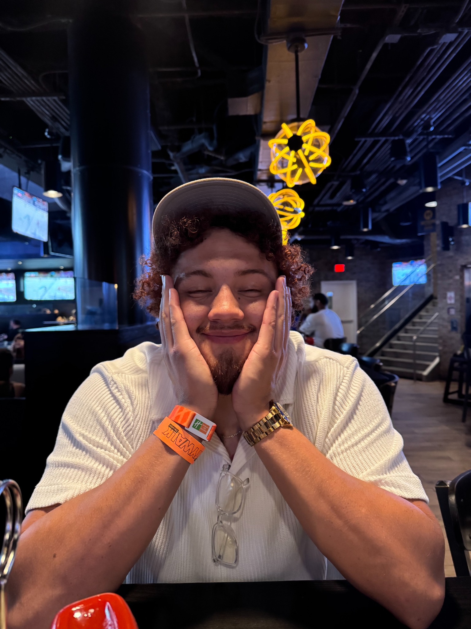 Travis M. Thompson smiling at a restaurant
