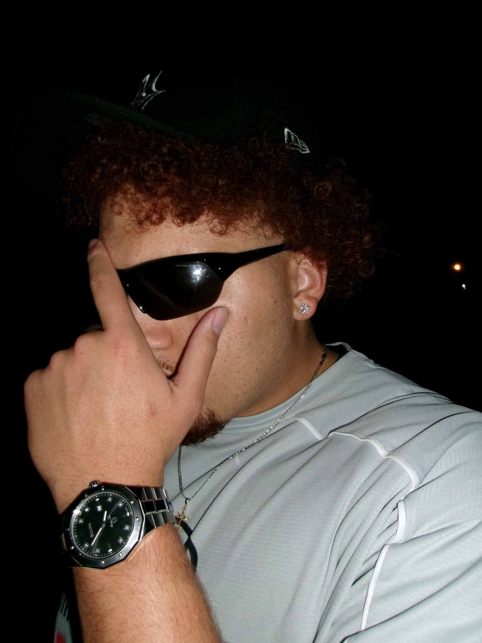 Travis M. Thompson wearing sunglasses at night